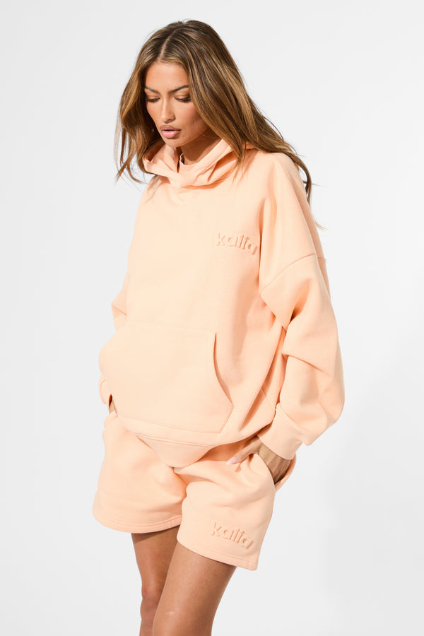 Kaiia Embossed Logo Oversized Hoodie Orange Sherbet