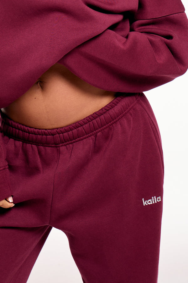 Kaiia Chrome Logo Mid Rise Wide Leg Joggers Burgundy