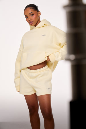 Kaiia Chrome Logo Mini Shorts Lemon