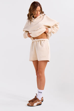 Kaiia Embossed Bubble Logo Mini Sweat Shorts Oatmilk