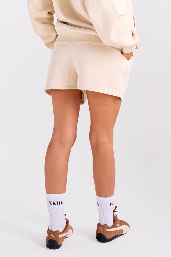 Kaiia Embossed Bubble Logo Mini Sweat Shorts Oatmilk
