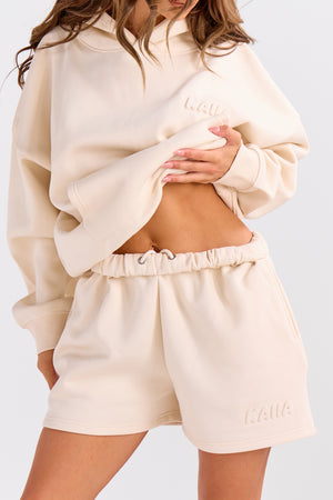 Kaiia Embossed Bubble Logo Mini Sweat Shorts Oatmilk