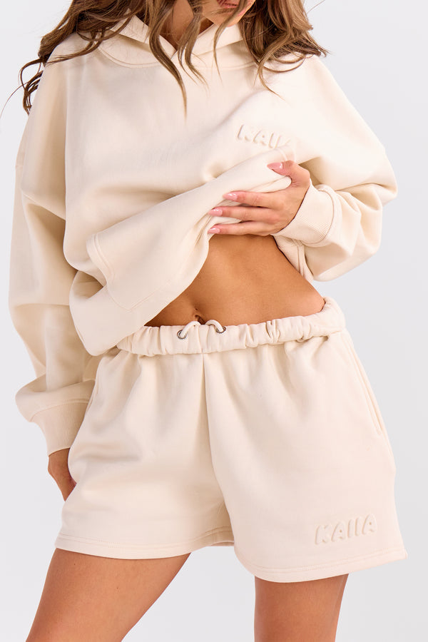 Kaiia Embossed Bubble Logo Mini Sweat Shorts Oatmilk