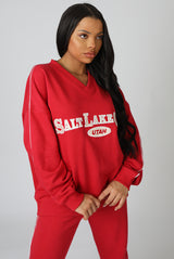 OVERSIZED VARSITY PIPING DETAIL SWEATSHIRT RED