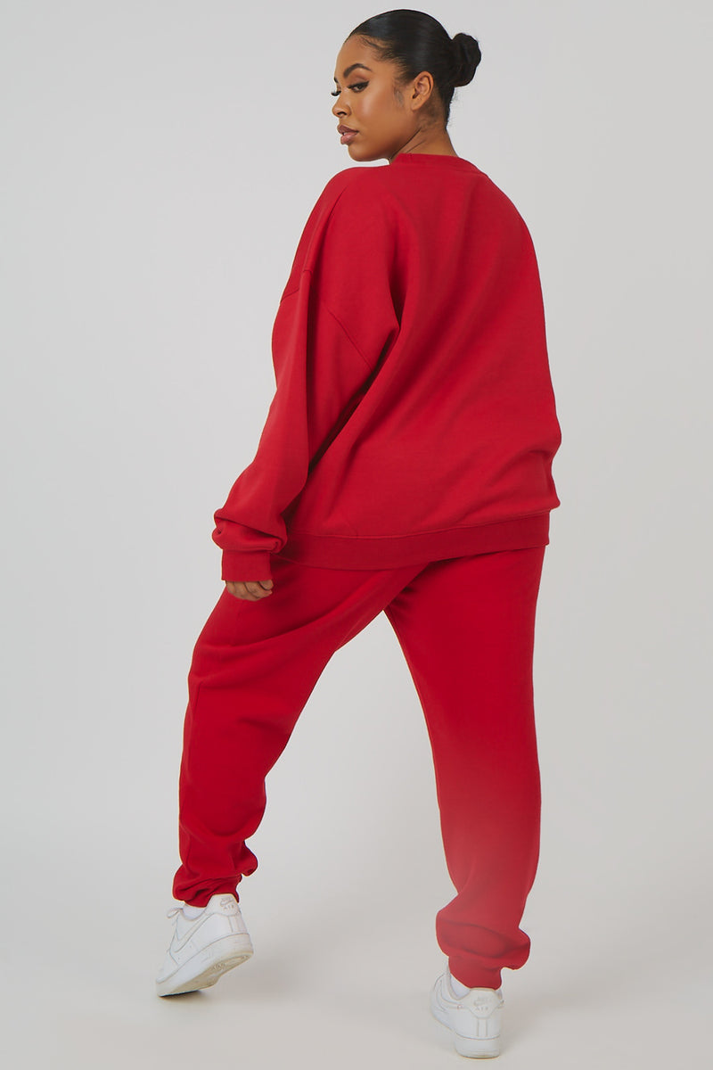 CURVE OVERSIZED EMBROIDERED SLOGAN 90S JOGGERS RED